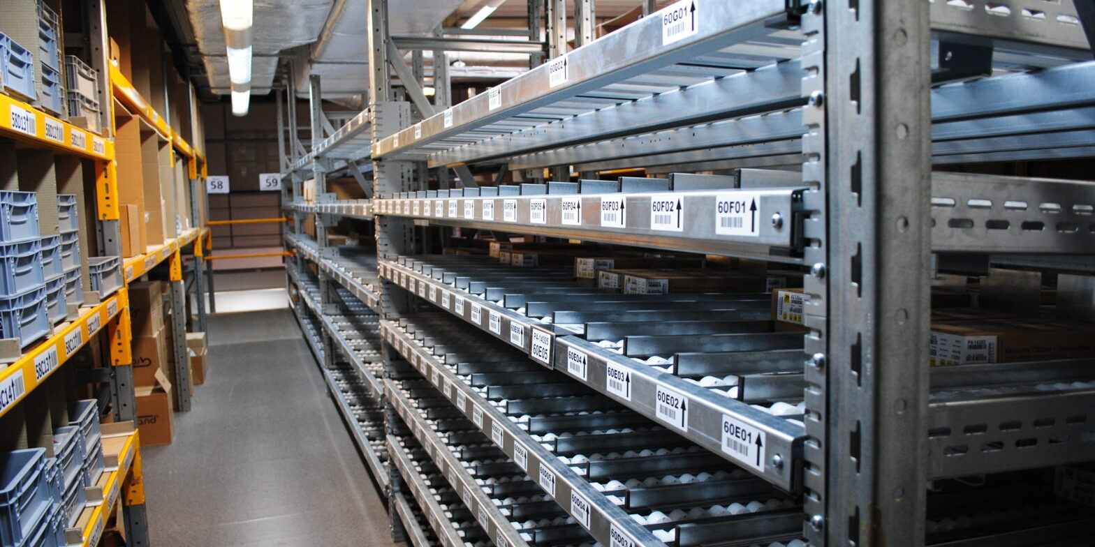 Automated warehouse with RFID-enabled shelving scanning metal parts