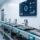 Professional hospital SPD environment with UHF RFID readers installed at tray docking stations, stainless steel surgical instrument trays, and digital dashboard showing real-time tracking status