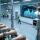 Professional overhead view of RFID-enabled crowd management system with wristbands, fixed readers, and digital dashboard in clean industrial setting