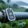 IP68 waterproof UHF RFID tag on outdoor industrial pipe in tropical rain, green foliage background
