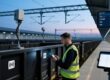 UHF RFID tags on European freight wagons and handheld scanner in rail yard