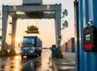 Indonesian port container gate with RFID reader and antenna scanning a truck